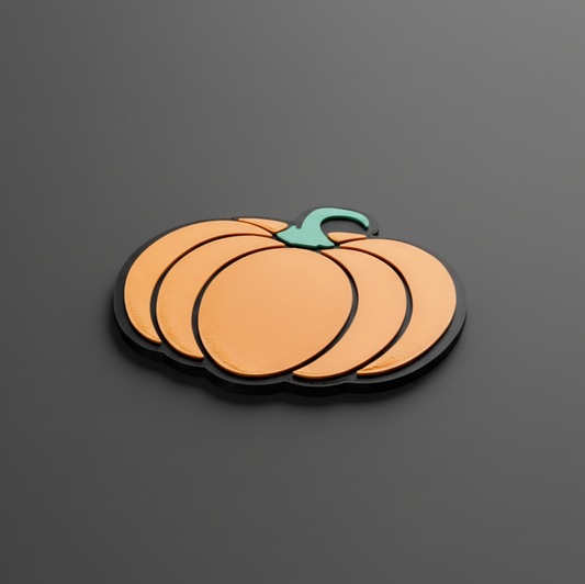 Pumpkin-shaped drink coaster on a dark gray background